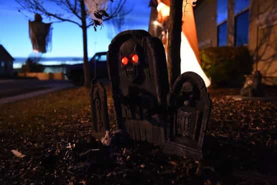 Halloween lawn decoration of gravestone with a skull