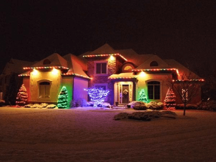 Home with multi-colored holiday lighting